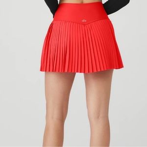 ALO YOGA GRAND SLAM TENNIS SKIRT- RED HOT SUMMMER